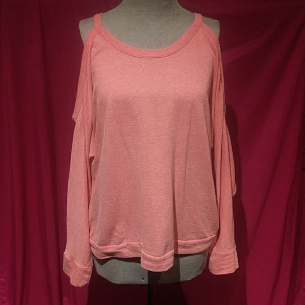 Coral-colored cold shoulder shirt
